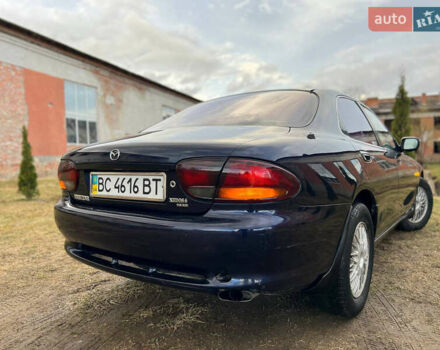 Синий Мазда Кседос 6, объемом двигателя 2 л и пробегом 300 тыс. км за 2250 $, фото 32 на Automoto.ua