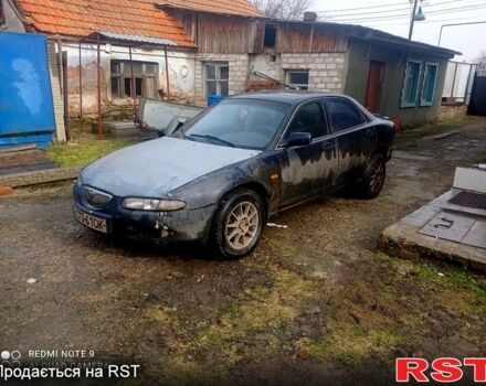 Синий Мазда Кседос 6, объемом двигателя 2 л и пробегом 300 тыс. км за 1350 $, фото 1 на Automoto.ua