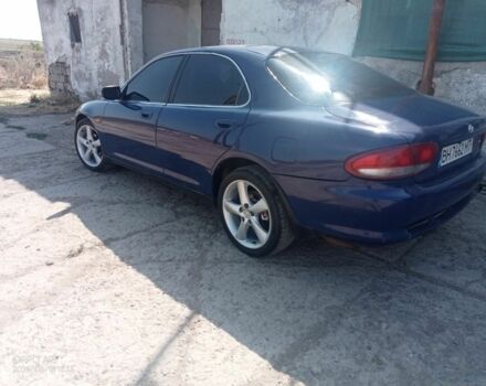 Синий Мазда Кседос 6, объемом двигателя 2 л и пробегом 245 тыс. км за 1800 $, фото 1 на Automoto.ua