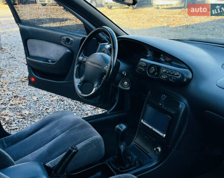 Зеленый Мазда Кседос 6, объемом двигателя 2 л и пробегом 213 тыс. км за 1900 $, фото 19 на Automoto.ua