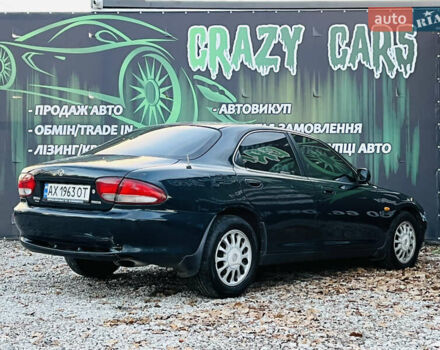 Зеленый Мазда Кседос 6, объемом двигателя 2 л и пробегом 213 тыс. км за 1900 $, фото 5 на Automoto.ua