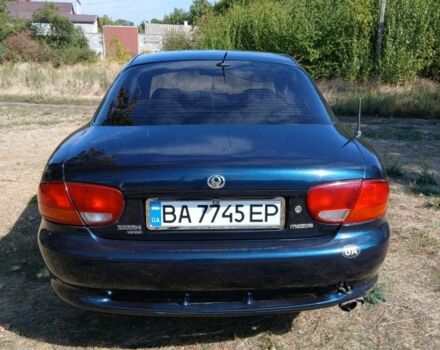 Зелений Мазда Кседос 6, об'ємом двигуна 2 л та пробігом 375 тис. км за 3100 $, фото 3 на Automoto.ua