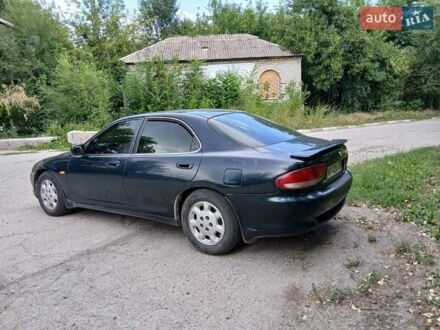 Зелений Мазда Кседос 6, об'ємом двигуна 2 л та пробігом 300 тис. км за 2062 $, фото 1 на Automoto.ua