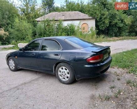 Зелений Мазда Кседос 6, об'ємом двигуна 2 л та пробігом 300 тис. км за 2062 $, фото 1 на Automoto.ua