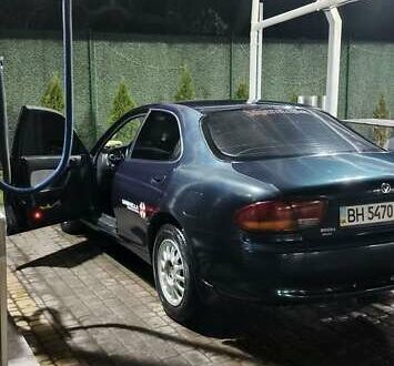 Зеленый Мазда Кседос 6, объемом двигателя 2 л и пробегом 300 тыс. км за 2600 $, фото 1 на Automoto.ua