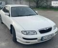 Белый Мазда Кседос 9, объемом двигателя 2.5 л и пробегом 410 тыс. км за 3300 $, фото 1 на Automoto.ua