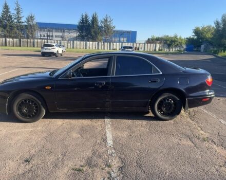 Черный Мазда Кседос 9, объемом двигателя 2 л и пробегом 3 тыс. км за 1800 $, фото 1 на Automoto.ua