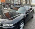 Черный Мазда Кседос 9, объемом двигателя 2 л и пробегом 245 тыс. км за 2000 $, фото 1 на Automoto.ua