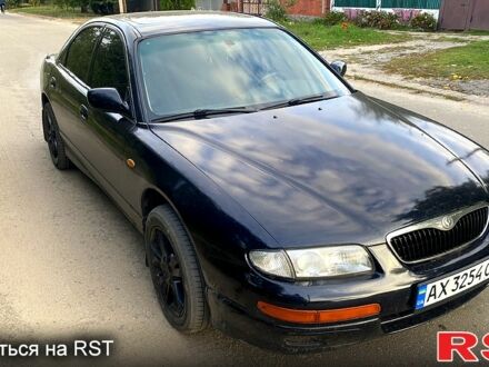 Черный Мазда Кседос 9, объемом двигателя 2 л и пробегом 347 тыс. км за 2400 $, фото 1 на Automoto.ua