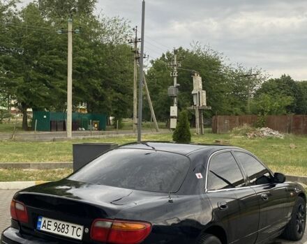 Чорний Мазда Кседос 9, об'ємом двигуна 2 л та пробігом 300 тис. км за 1900 $, фото 1 на Automoto.ua