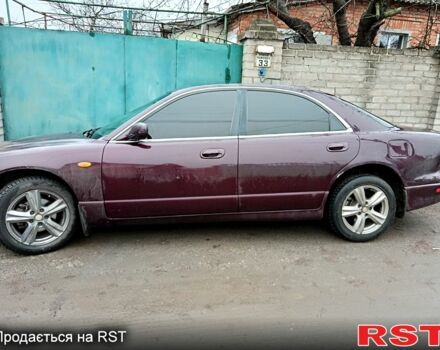 Красный Мазда Кседос 9, объемом двигателя 2 л и пробегом 200 тыс. км за 2500 $, фото 4 на Automoto.ua