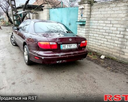 Красный Мазда Кседос 9, объемом двигателя 2 л и пробегом 200 тыс. км за 2500 $, фото 1 на Automoto.ua