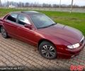 Червоний Мазда Кседос 9, об'ємом двигуна 2 л та пробігом 250 тис. км за 2000 $, фото 1 на Automoto.ua