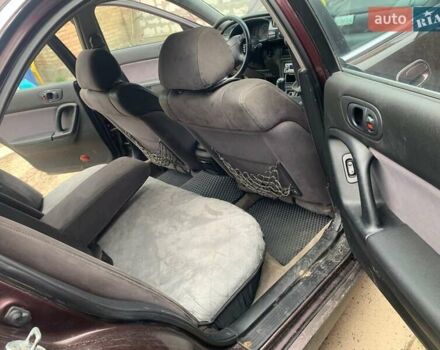 Красный Мазда Кседос 9, объемом двигателя 2 л и пробегом 285 тыс. км за 2000 $, фото 1 на Automoto.ua