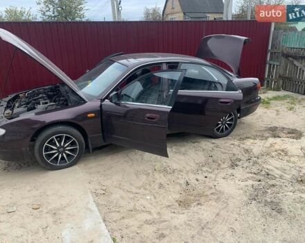 Красный Мазда Кседос 9, объемом двигателя 2 л и пробегом 285 тыс. км за 2000 $, фото 4 на Automoto.ua