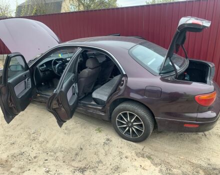 Червоний Мазда Кседос 9, об'ємом двигуна 2 л та пробігом 285 тис. км за 2000 $, фото 10 на Automoto.ua