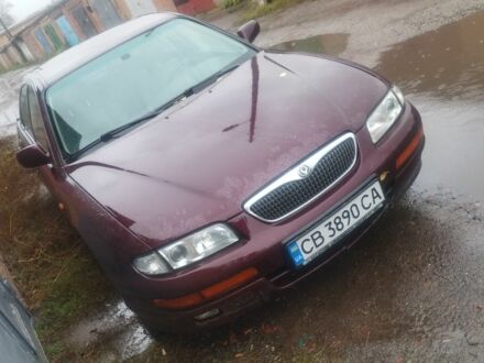 Червоний Мазда Кседос 9, об'ємом двигуна 2 л та пробігом 300 тис. км за 1000 $, фото 1 на Automoto.ua