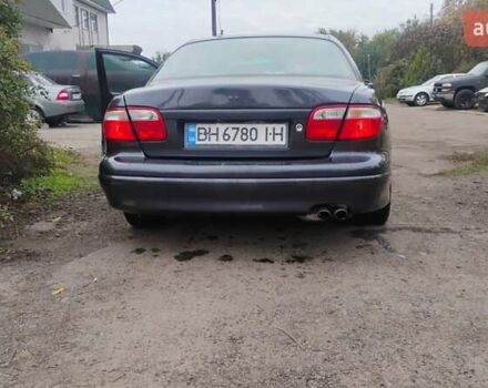 Серый Мазда Кседос 9, объемом двигателя 2.5 л и пробегом 341 тыс. км за 3500 $, фото 5 на Automoto.ua