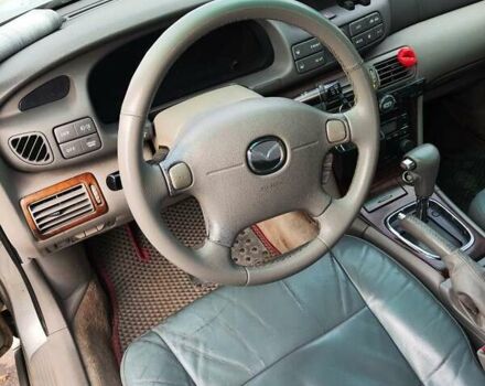 Серый Мазда Кседос 9, объемом двигателя 2.5 л и пробегом 274 тыс. км за 2700 $, фото 4 на Automoto.ua