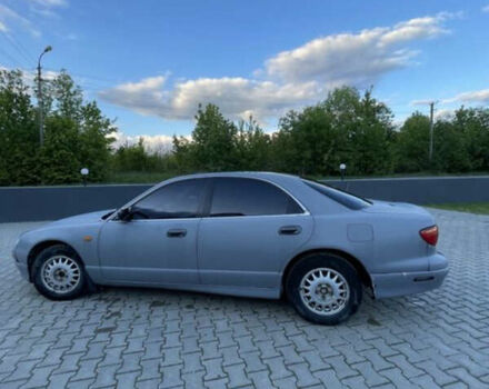 Серый Мазда Кседос 9, объемом двигателя 2 л и пробегом 300 тыс. км за 1650 $, фото 1 на Automoto.ua