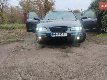 Серый Мазда Кседос 9, объемом двигателя 2.5 л и пробегом 341 тыс. км за 3500 $, фото 1 на Automoto.ua