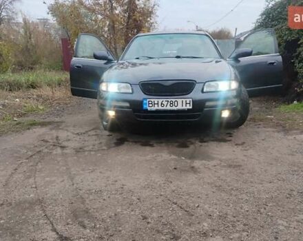 Серый Мазда Кседос 9, объемом двигателя 2.5 л и пробегом 341 тыс. км за 3500 $, фото 1 на Automoto.ua