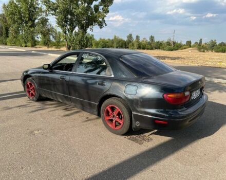 Синий Мазда Кседос 9, объемом двигателя 2.5 л и пробегом 420 тыс. км за 1800 $, фото 1 на Automoto.ua