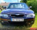 Синий Мазда Кседос 9, объемом двигателя 2 л и пробегом 350 тыс. км за 3300 $, фото 1 на Automoto.ua