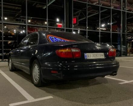 Синий Мазда Кседос 9, объемом двигателя 2.5 л и пробегом 385 тыс. км за 2200 $, фото 1 на Automoto.ua