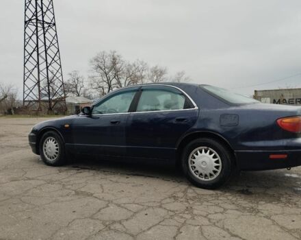 Синій Мазда Кседос 9, об'ємом двигуна 2 л та пробігом 200 тис. км за 2300 $, фото 1 на Automoto.ua