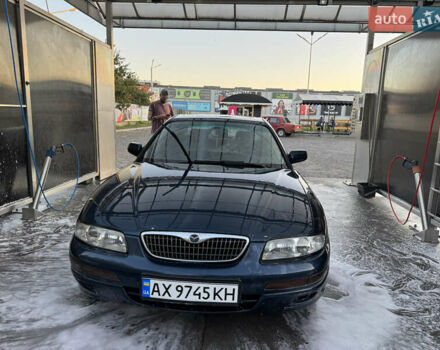 Синий Мазда Кседос 9, объемом двигателя 2.5 л и пробегом 288 тыс. км за 3500 $, фото 1 на Automoto.ua