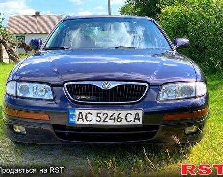 Синий Мазда Кседос 9, объемом двигателя 2 л и пробегом 350 тыс. км за 3300 $, фото 1 на Automoto.ua