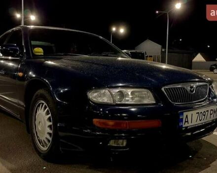 Синий Мазда Кседос 9, объемом двигателя 2.5 л и пробегом 380 тыс. км за 2100 $, фото 1 на Automoto.ua