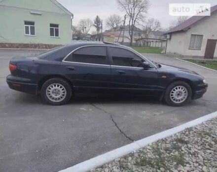Синий Мазда Кседос 9, объемом двигателя 2.3 л и пробегом 300 тыс. км за 2200 $, фото 1 на Automoto.ua