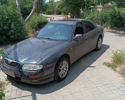 Синий Мазда Кседос 9, объемом двигателя 2.5 л и пробегом 300 тыс. км за 1800 $, фото 1 на Automoto.ua