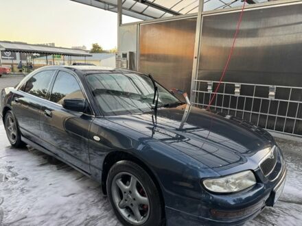 Синий Мазда Кседос 9, объемом двигателя 2.5 л и пробегом 288 тыс. км за 3600 $, фото 1 на Automoto.ua