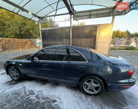 Синий Мазда Кседос 9, объемом двигателя 2.5 л и пробегом 288 тыс. км за 3500 $, фото 1 на Automoto.ua