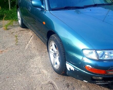 Зеленый Мазда Кседос 9, объемом двигателя 2.3 л и пробегом 255 тыс. км за 1400 $, фото 1 на Automoto.ua