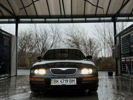 Зелений Мазда Кседос 9, об'ємом двигуна 2.5 л та пробігом 360 тис. км за 2700 $, фото 1 на Automoto.ua