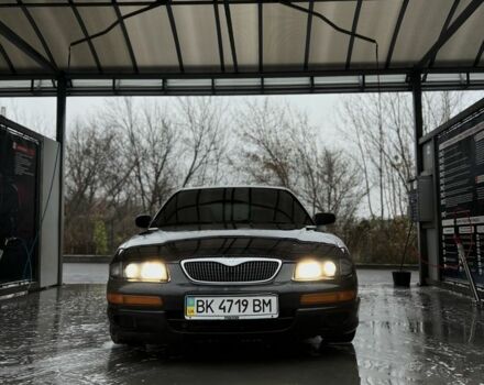 Зеленый Мазда Кседос 9, объемом двигателя 2.5 л и пробегом 360 тыс. км за 2700 $, фото 1 на Automoto.ua