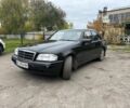 Черный Мерседес Ц-Класс, объемом двигателя 1.8 л и пробегом 400 тыс. км за 2500 $, фото 1 на Automoto.ua