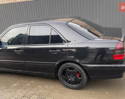 Чорний Мерседес Ц-Клас, об'ємом двигуна 2 л та пробігом 260 тис. км за 2598 $, фото 5 на Automoto.ua