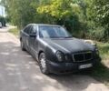 Черный Мерседес Е-Класс, объемом двигателя 2.4 л и пробегом 390 тыс. км за 1701 $, фото 1 на Automoto.ua