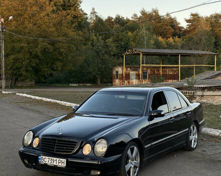 Черный Мерседес Е-Класс, объемом двигателя 2 л и пробегом 350 тыс. км за 2699 $, фото 1 на Automoto.ua