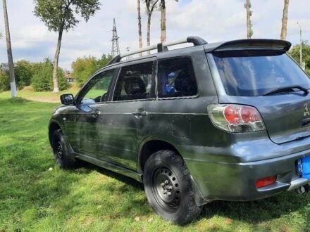 Серый Мицубиси Аиртрек, объемом двигателя 2.4 л и пробегом 299 тыс. км за 6099 $, фото 1 на Automoto.ua