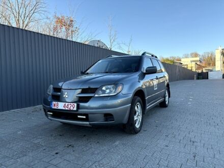 Синий Мицубиси Аиртрек, объемом двигателя 2.4 л и пробегом 353 тыс. км за 3500 $, фото 1 на Automoto.ua