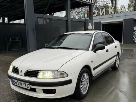 Білий Міцубісі Харизма, об'ємом двигуна 1.83 л та пробігом 290 тис. км за 3100 $, фото 1 на Automoto.ua