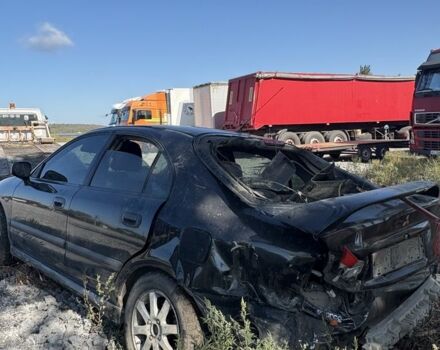 Черный Мицубиси Харизма, объемом двигателя 0 л и пробегом 200 тыс. км за 1000 $, фото 7 на Automoto.ua