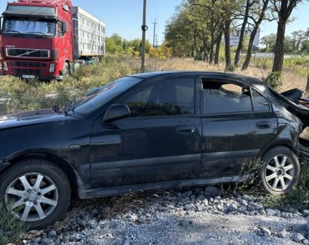 Черный Мицубиси Харизма, объемом двигателя 0 л и пробегом 200 тыс. км за 1000 $, фото 3 на Automoto.ua