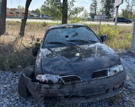 Черный Мицубиси Харизма, объемом двигателя 0 л и пробегом 200 тыс. км за 1000 $, фото 5 на Automoto.ua